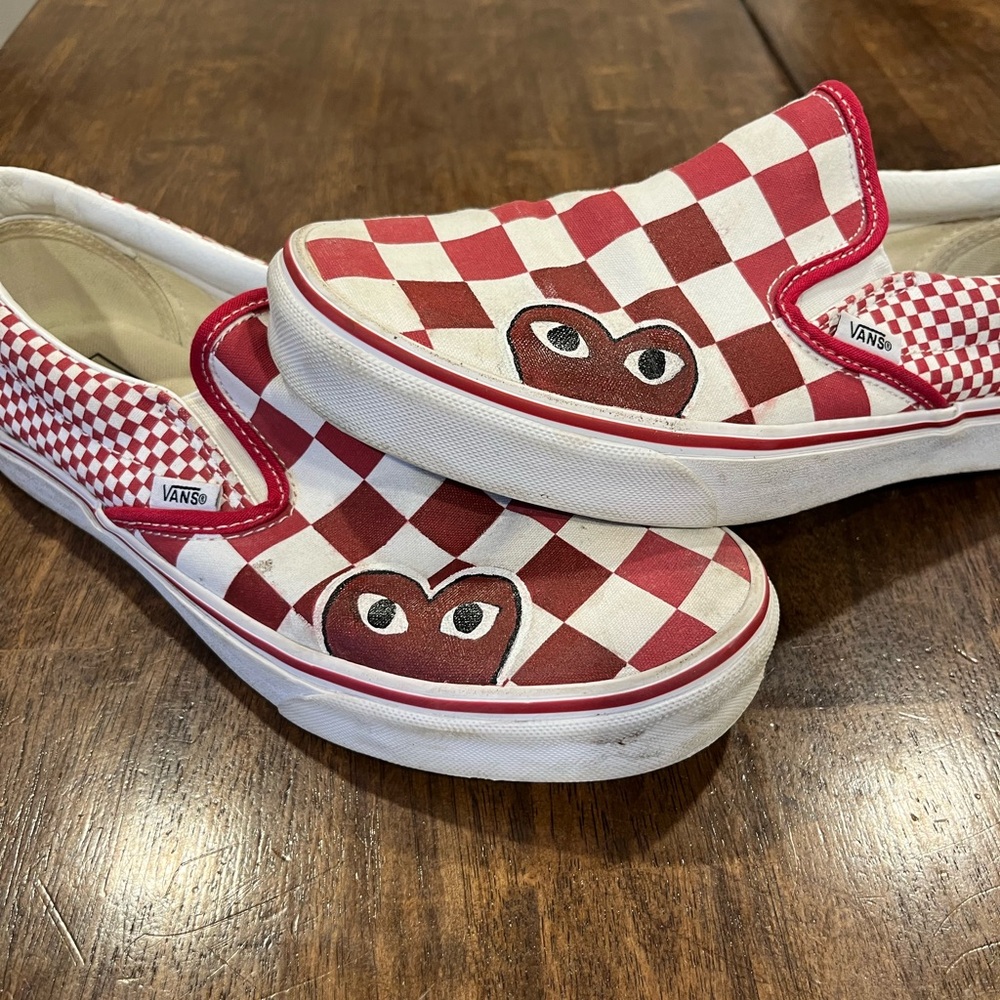 Red and white customized Comme des Garçons Vans slip on trainers
